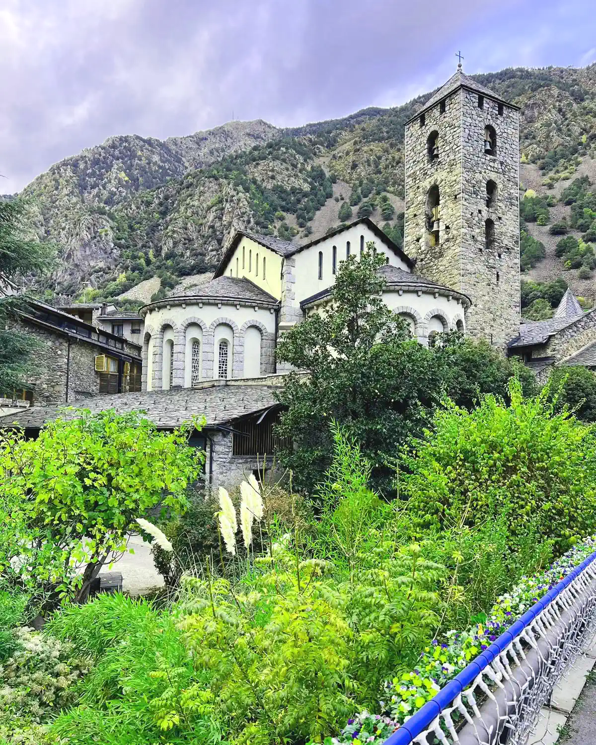 Romanesque stone church in Andorra surrounded by the Pyrenees mountains
