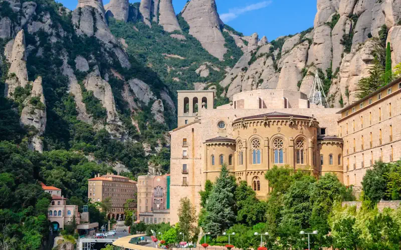 Montserrat monastery and basilica surrounded by the mountain peaks near Barcelona
