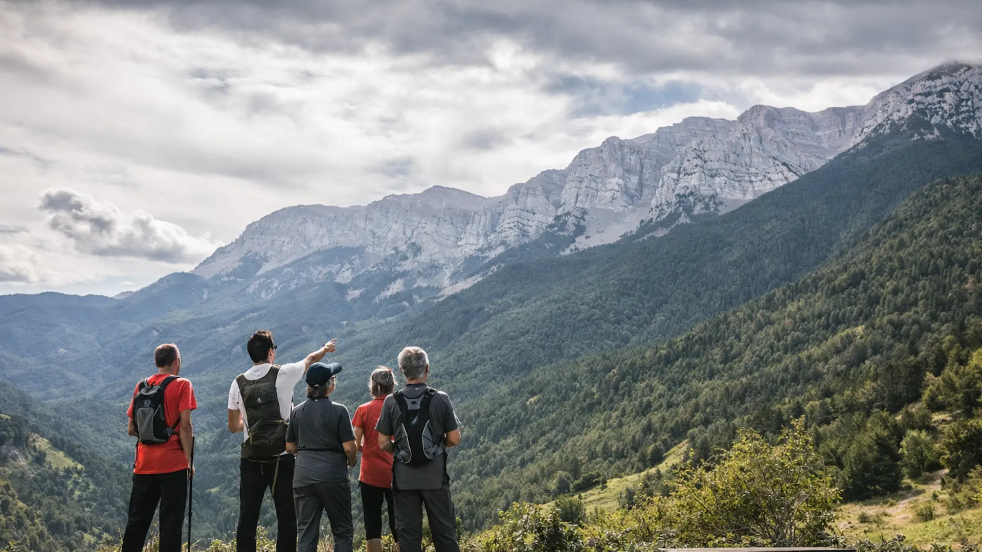 Travelers walking a WWII escape route in the Pyrenees mountains near Andorra