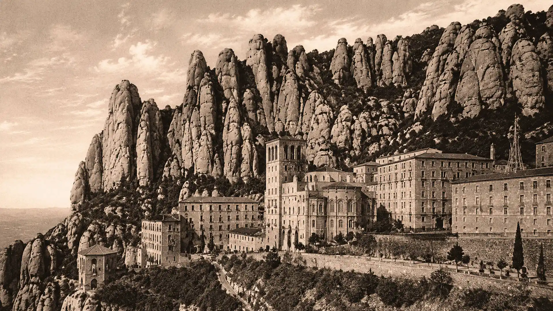 Historic view of Montserrat Monastery beneath the mountain formations