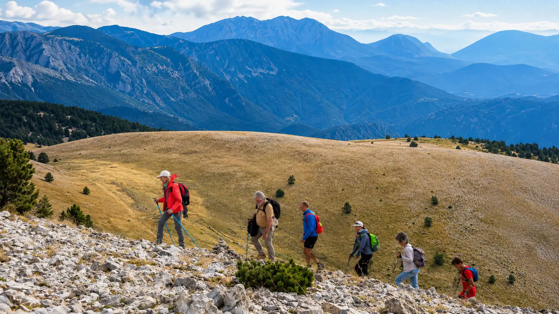 Hikers crossing a mountain trail in the Pyrenees similar to WWII escape routes